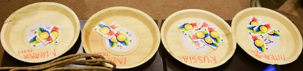 1st Innompic Games Team Assessment Gold Coin Cards in plates